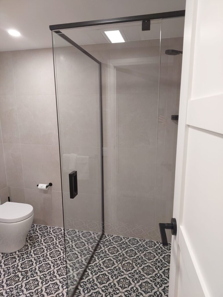 Shower showing clean grout in bathroom